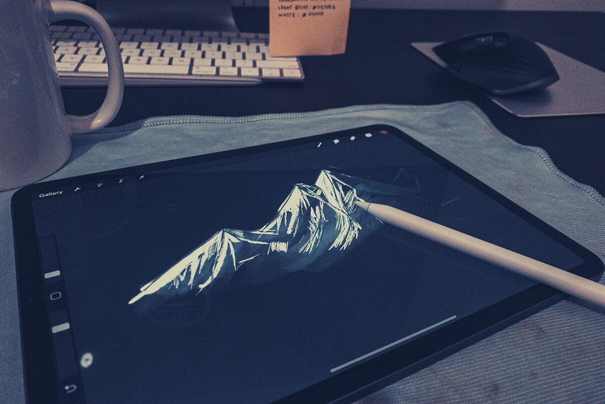 Graphic tablet with picture of mountain on screen